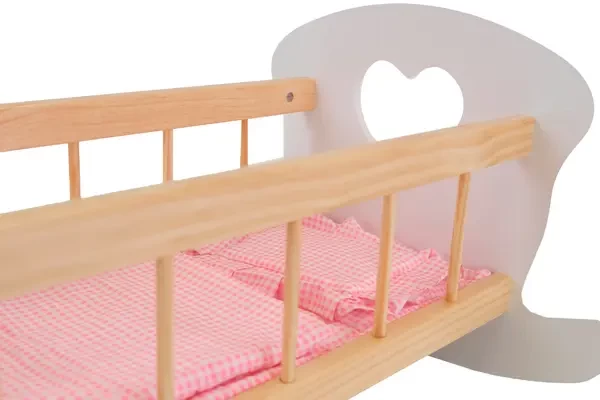 Wit bedje met houten spijltjes