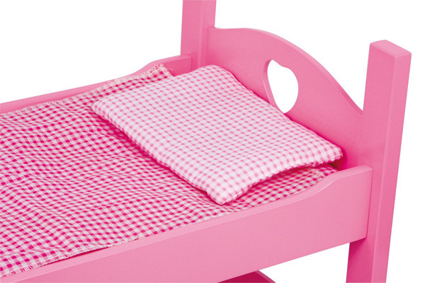 Bijpassend roze geruit beddengoed.